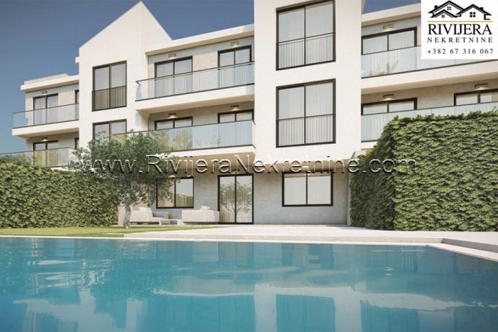 Townhouse complex with a pool and parking in Rezevici Budva