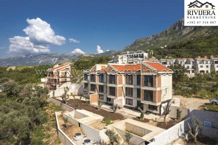 Townhouse complex with a pool and parking in Rezevici Budva