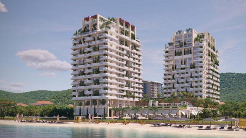 Luxury hotel with 212 residences, 144 rooms, and prime location near beach & city center