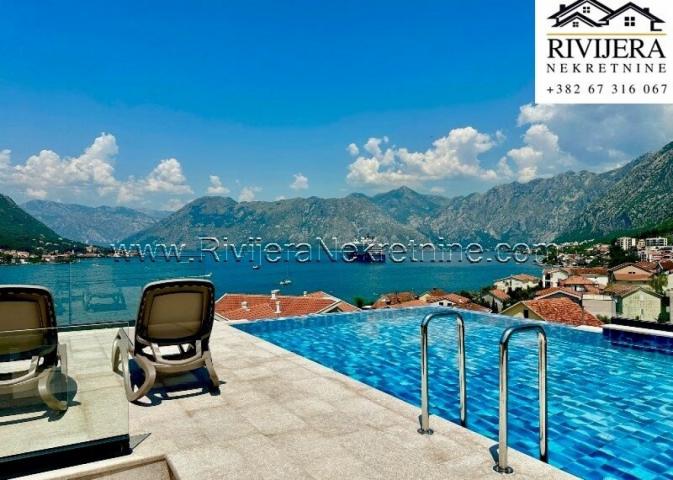 For sale luxury three-bedroom apartment with a pool in Dobrota Kotor