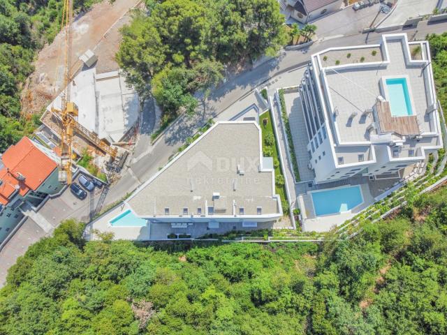 OPATIJA, ZENTRUM - geräumige Wohnung in einem neuen Gebäude mit Meerblick, Gemeinschaftspool, Garage