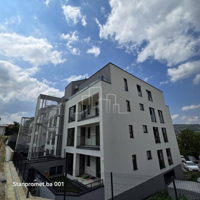 NEWLY BUILT Kromolj three-room apartment with garage for sale