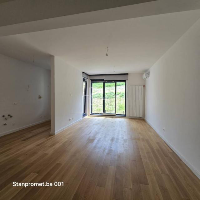 NEWLY BUILT Kromolj three-room apartment with garage for sale