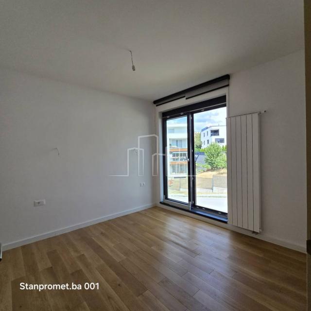 NEWLY BUILT Kromolj three-room apartment with garage for sale