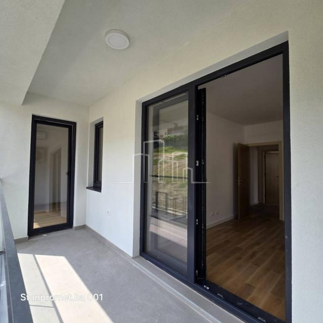 NEWLY BUILT Kromolj three-room apartment with garage for sale