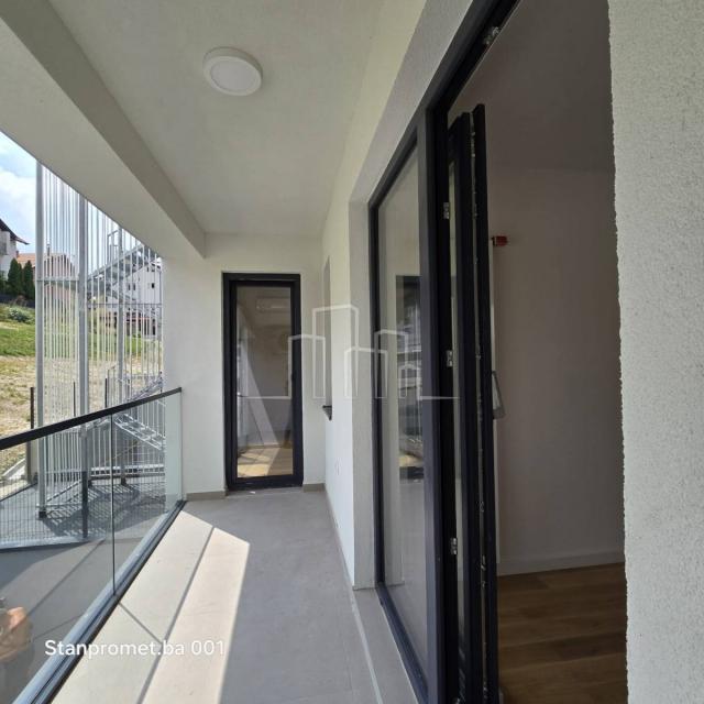 NEWLY BUILT Kromolj three-room apartment with garage for sale