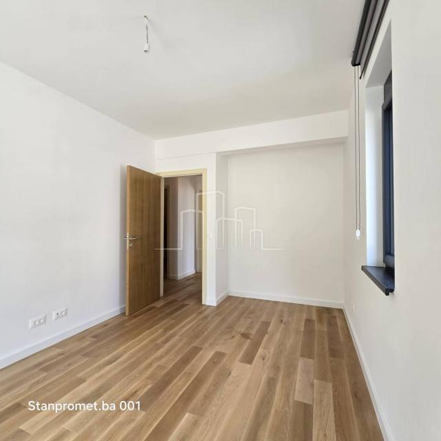 NEWLY BUILT Kromolj three-room apartment with garage for sale