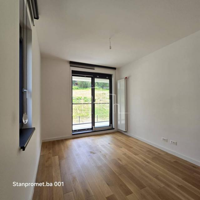 NEWLY BUILT Kromolj three-room apartment with garage for sale