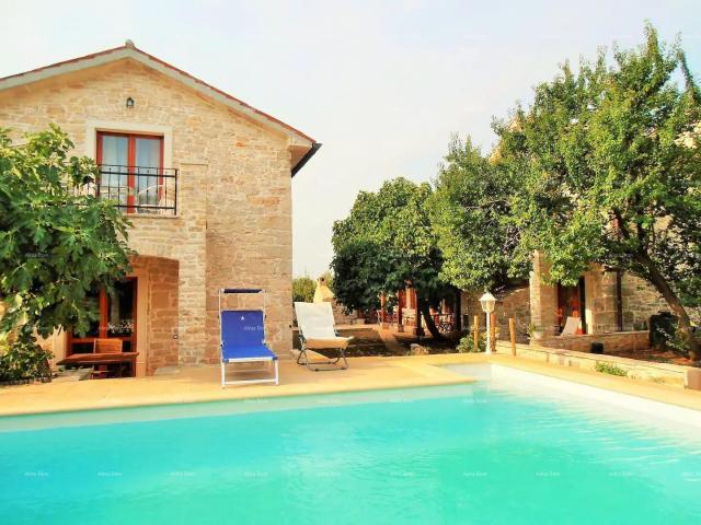 House Two stone houses with a swimming pool