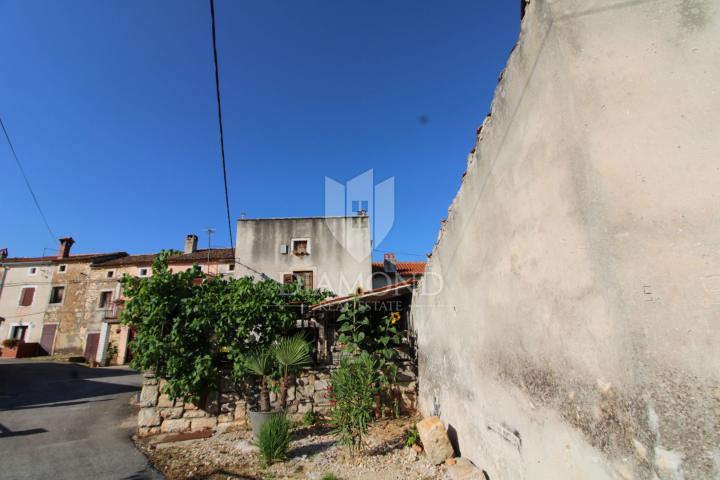 Marčana, two stone houses in a row for adaptation