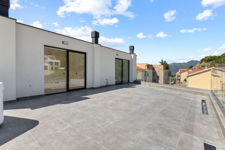 Modern two-bedroom apartment with spacious terraces and partial sea views