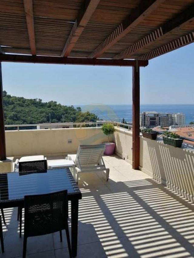 A four bedroom apartment for sale in Budva with a sea view