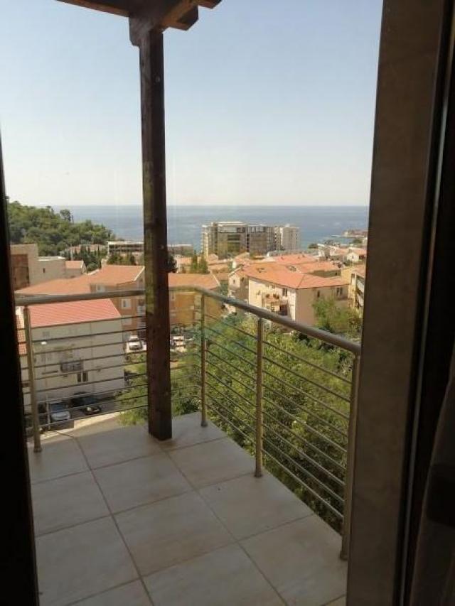 A four bedroom apartment for sale in Budva with a sea view