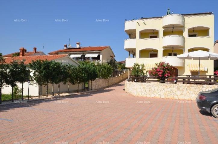 House Apartment building with pool in a great location, overlooking the sea in Medulin