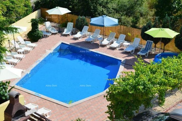 House Apartment building with pool in a great location, overlooking the sea in Medulin