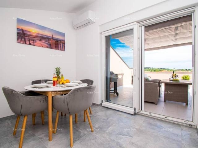 Apartment Medulin. Mukalba. Modern apartment with a large terrace and sea view.