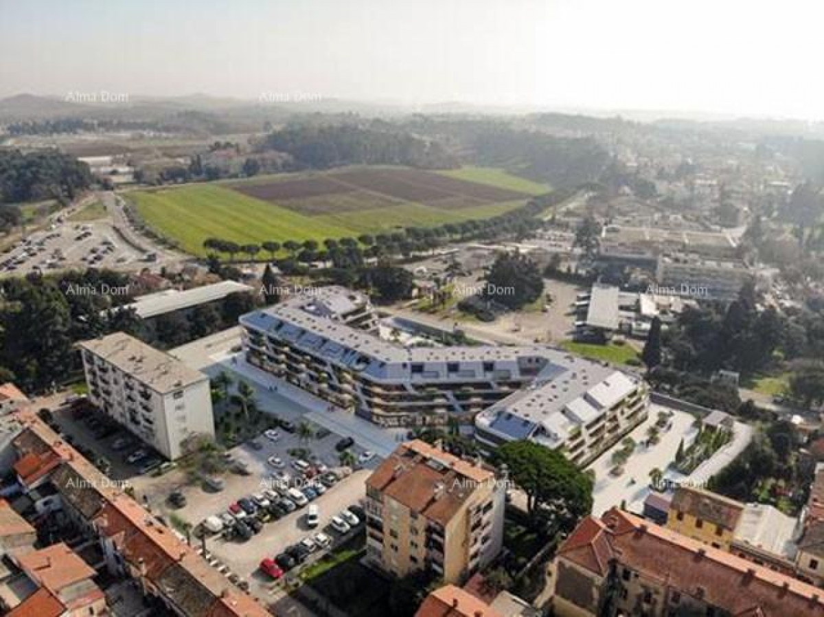 Apartment Poreč, residential and commercial building under construction with apartments and undergro