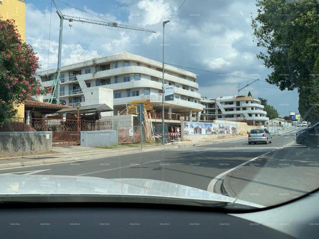 Apartment Poreč, residential and commercial building under construction with apartments and undergro