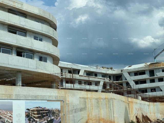 Apartment Poreč, residential and commercial building under construction with apartments and undergro