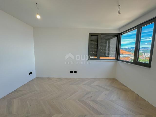 OPATIJA, CENTAR - 3S+DB stan 140m2 u novogradnji u centru Opatije, garaža, terasa, pogled na more