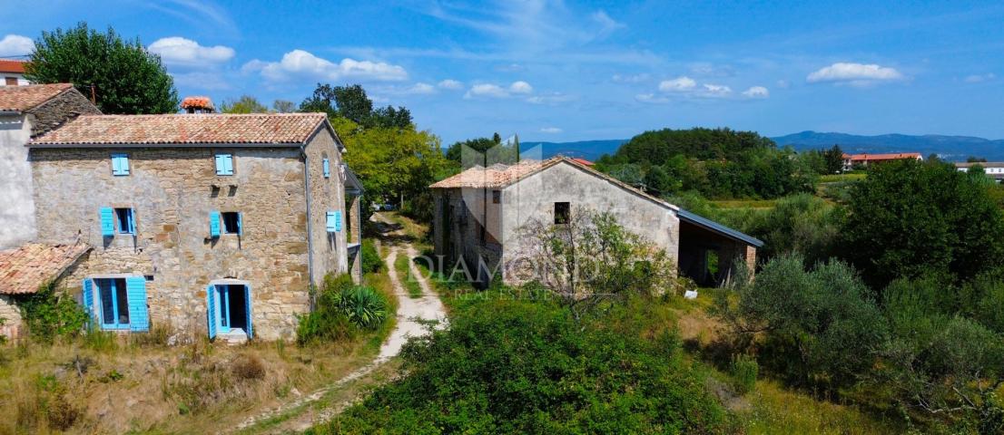 Cerovlje, surroundings, property with two stone houses and olive groves on a building plot