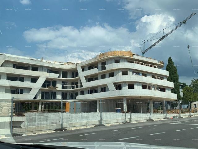 Apartment Poreč, residential and commercial building under construction with apartments and undergro