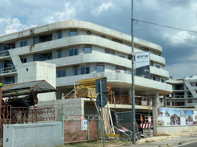 Apartment Poreč, residential and commercial building under construction with apartments and undergro