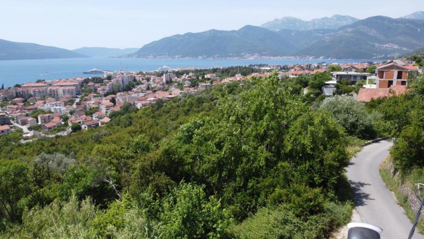 Plot in Tivat 1430 m2 with an approved project for the construction of 2 residential buildings