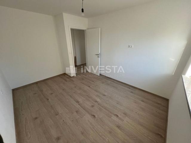 Medulin, two-room apartment on the ground floor of a new building with a garden of 90 m2