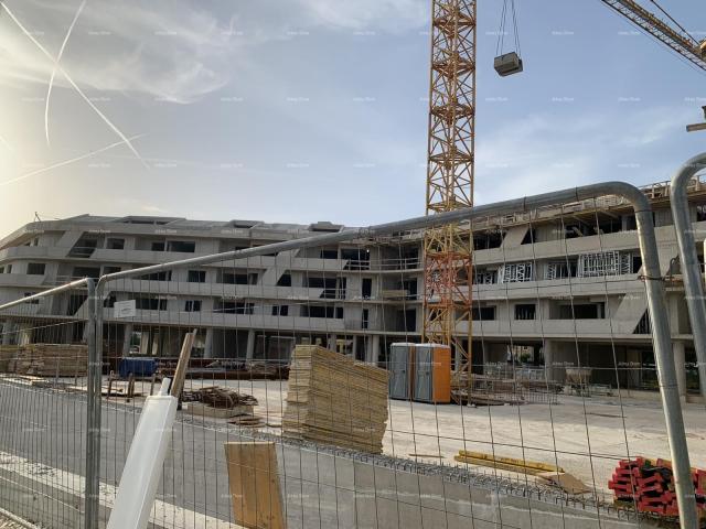 Apartment Poreč, residential and commercial building under construction with apartments and undergro