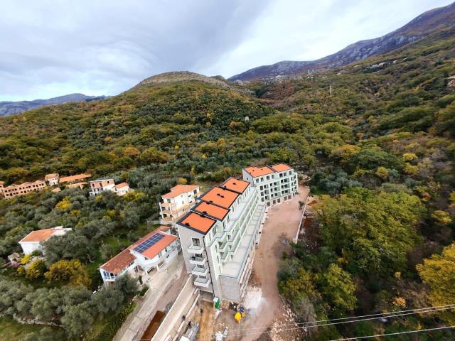 Prodaja jednosobnog stana 57m² u novogradnji sa bocnim pogledom na more, parkingom i oslobođenjem od