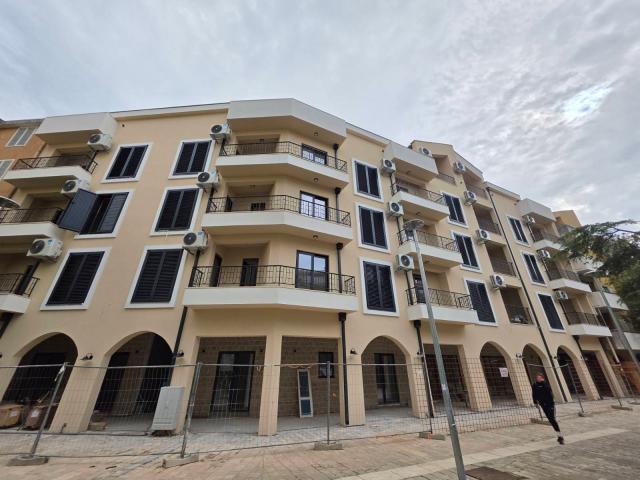 Dvosoban stan 71.08m² sa dodatnom galerijom 18m² u novom stambeno poslovnoj zgradi-Budva, Adok