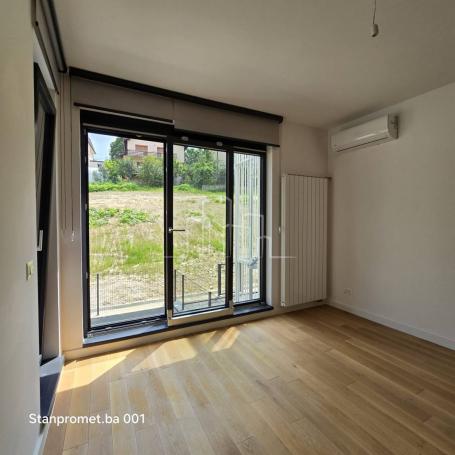 NEWLY BUILT Kromolj three-room apartment with garage for sale