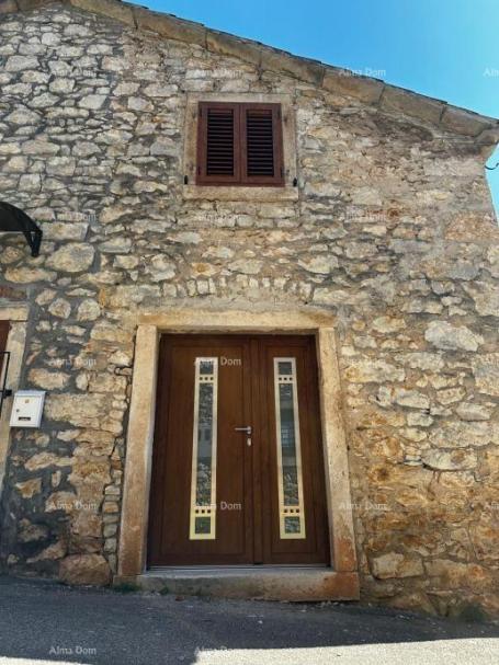 Stone house A house for sale in the center of Brtonigla with its own parking and yard