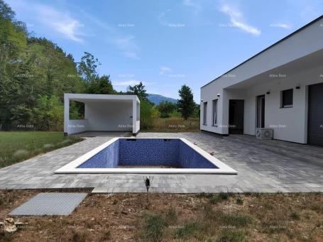 House A modern one-story house with a swimming pool and a summer kitchen is for sale, Kršan